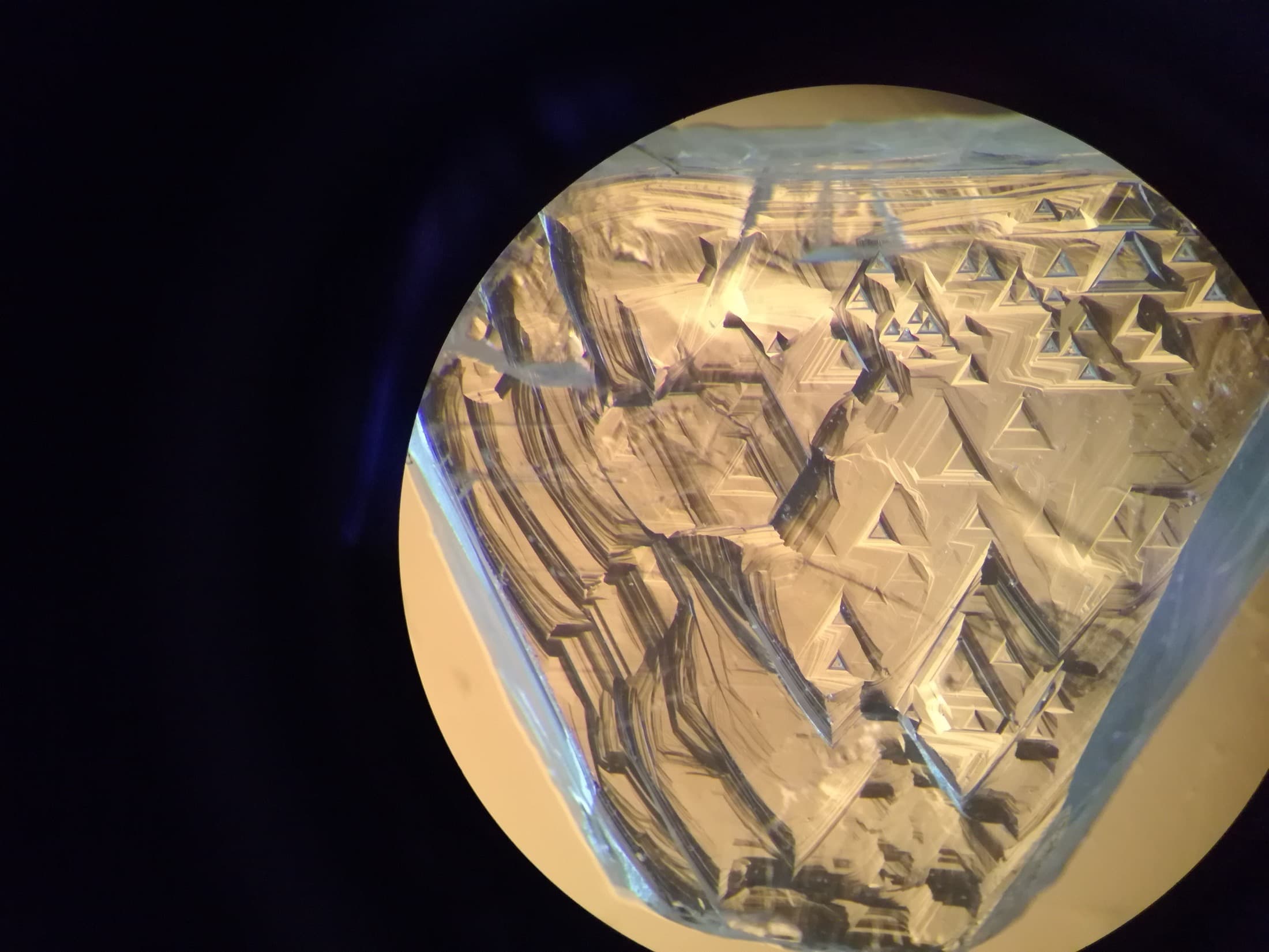 Extreme macro detail of a diamond's crystal facets Extreme macro detail of a diamond's crystal facets
